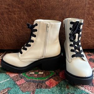 White combat boots with chunky heel.